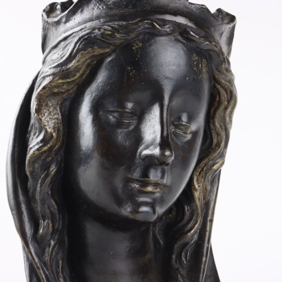 Female Face in Bronze